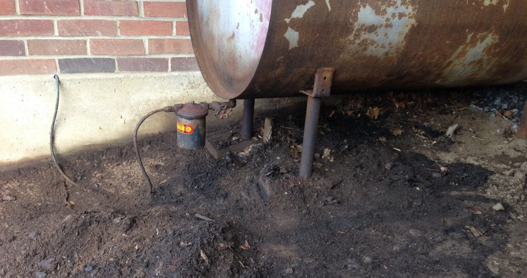 Leaking heating oil tank being replaced in a Queens NY basement